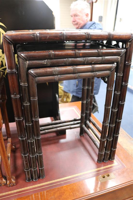 A nest of three Chinese hardwood tea tables W.48cm